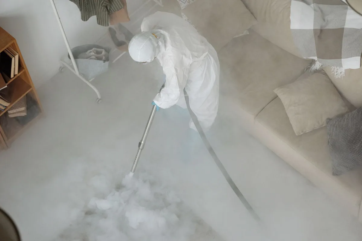 Biohazard cleanup technician in protective equipment, Lake Hamilton, AR